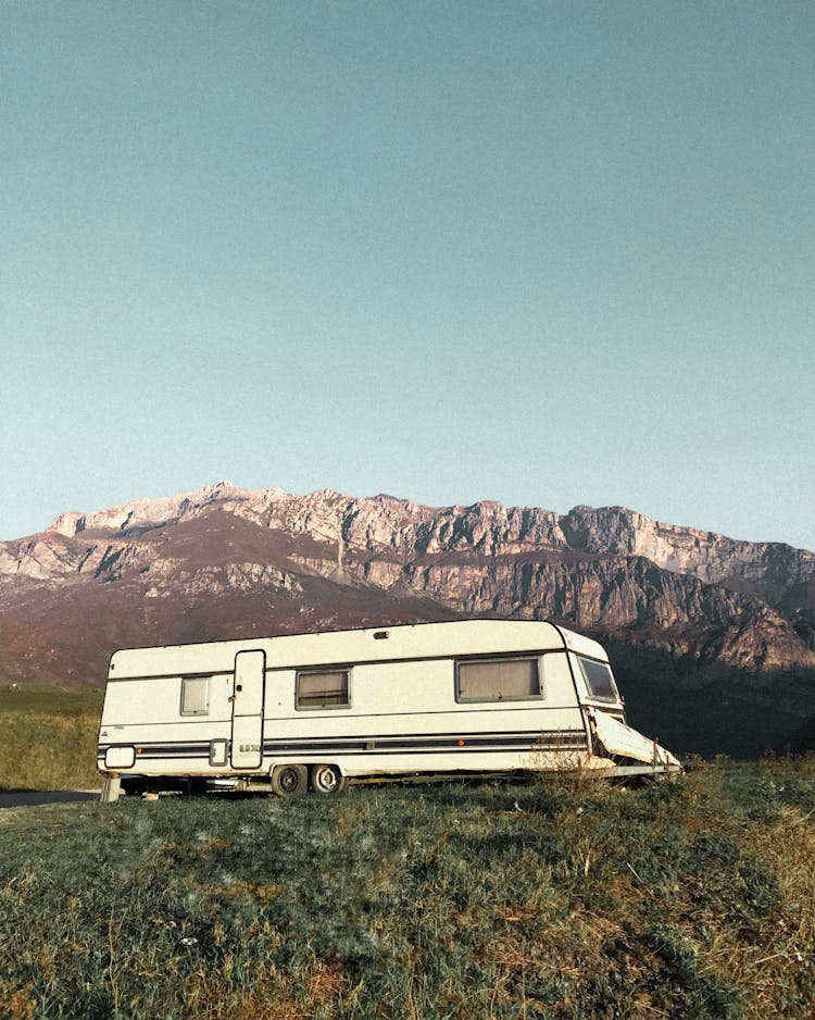 Camper Trailer In Mountains