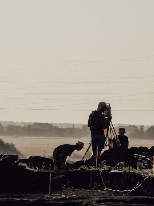 A Man Surveying a Field