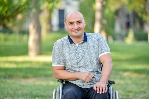 Free A Man Sitting on a Wheelchair  Stock Photo