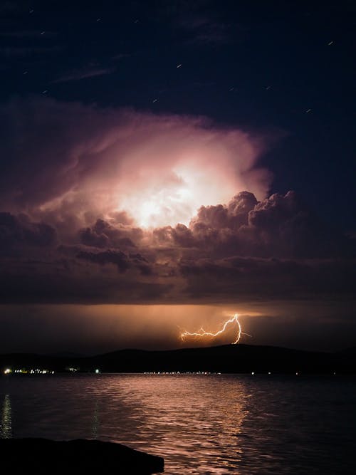 Lightning above Water at Night