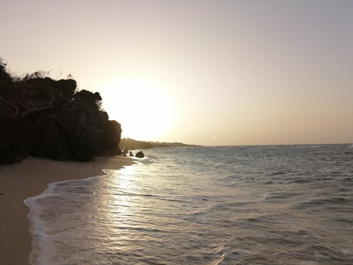 Безкоштовне стокове фото на тему «берег моря, Захід сонця, камінь»