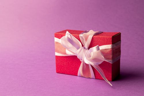 Free Close Up Photo of Red Box with Pink Ribbon Stock Photo