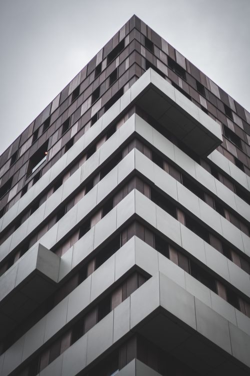 Free Low angle view of a modern skyscraper facade in Manchester, showcasing architectural design. Stock Photo