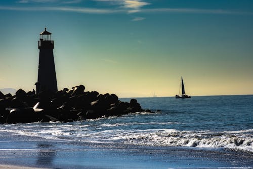 Free stock photo of lighthouse, ocean, sail boat