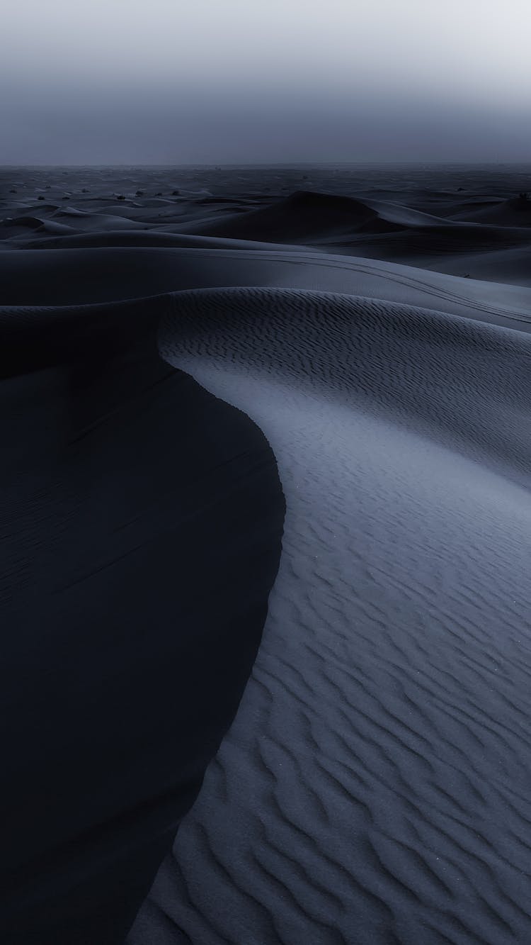 Wrinkled Desert Dune At Night