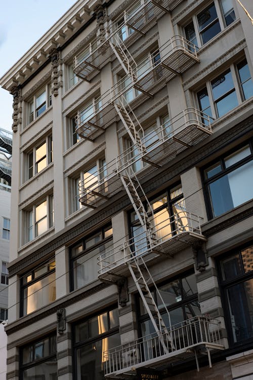 Free Apartment Building with Fire Escape Ladders Stock Photo