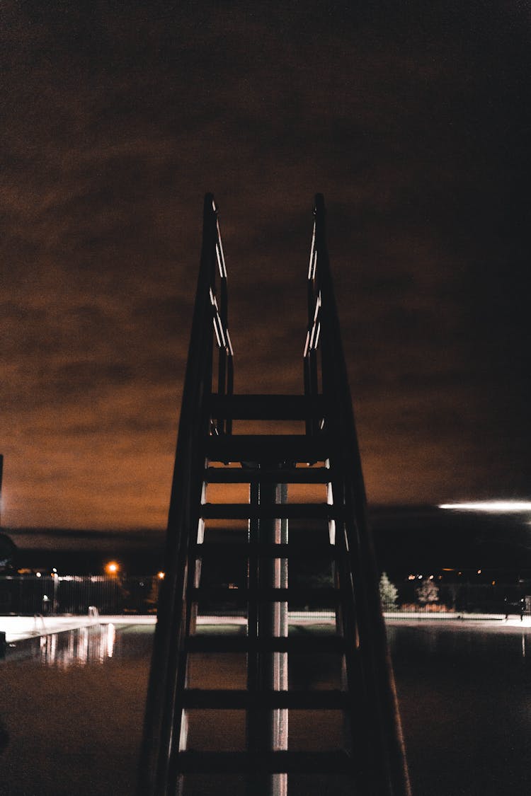 Ladder To A Diving Board By A Pool