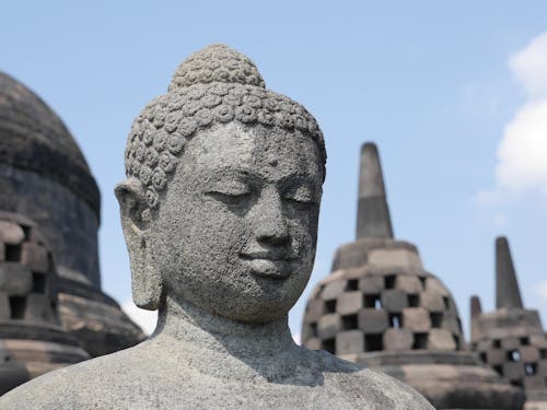 Stone Buddha Statue against Blue Sky