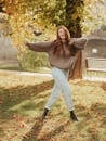 Young woman posing in autumn weather