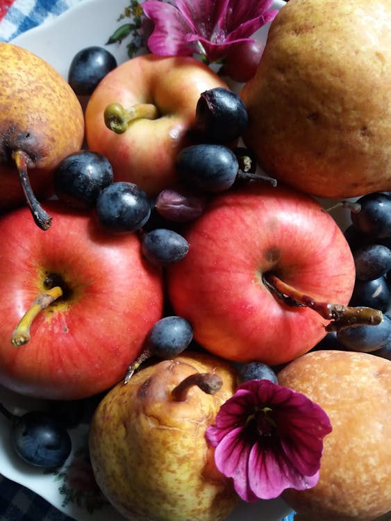 Close-Up Shot of Grapes and Apples
