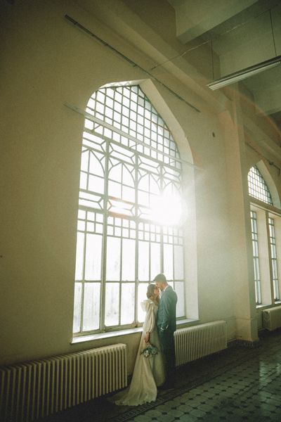 Couple in a sunlit hall on their wedding day — photo by Furknsaglam on Pexels