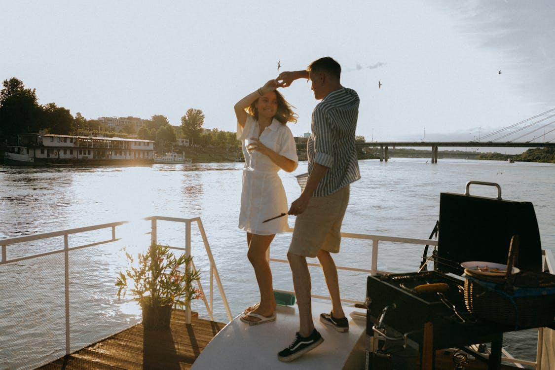 Free A Romantic Couple Dancing in the Yacht Stock Photo