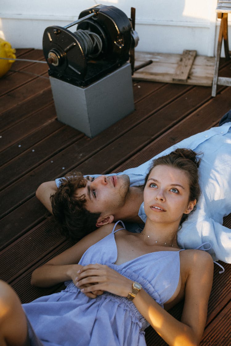 A Romantic Couple Lying On A Yacht