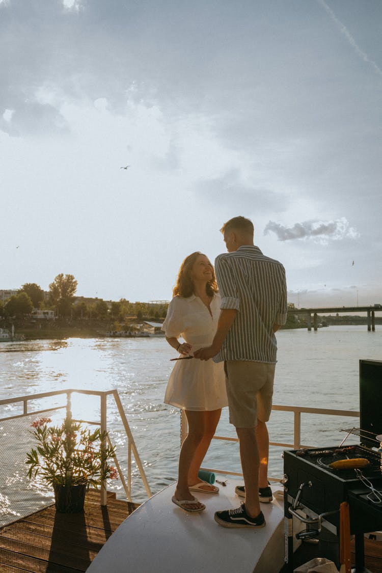 A Romantic Couple Dancing In The Yacht