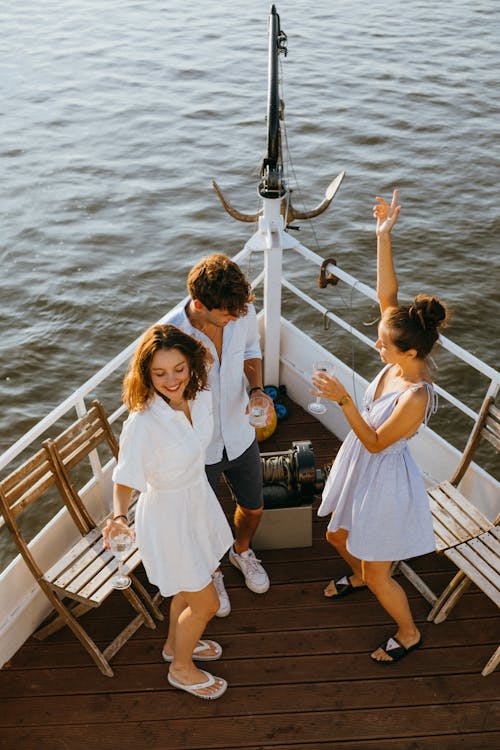 Free A Group of People Dancing in the Yacht Stock Photo