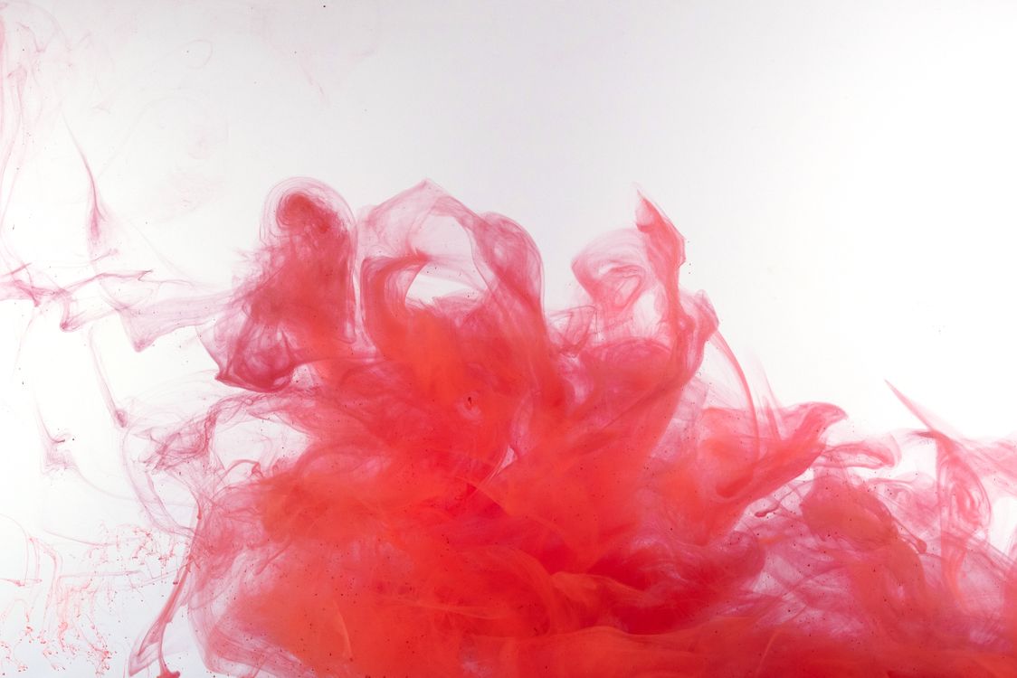 Close-Up Shot of Red Ink in Water · Free Stock Photo
