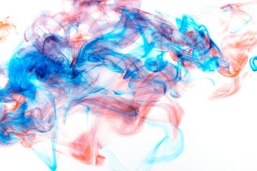 Blue and Orange High-Speed Photography of Colorful Ink Diffusion in Water