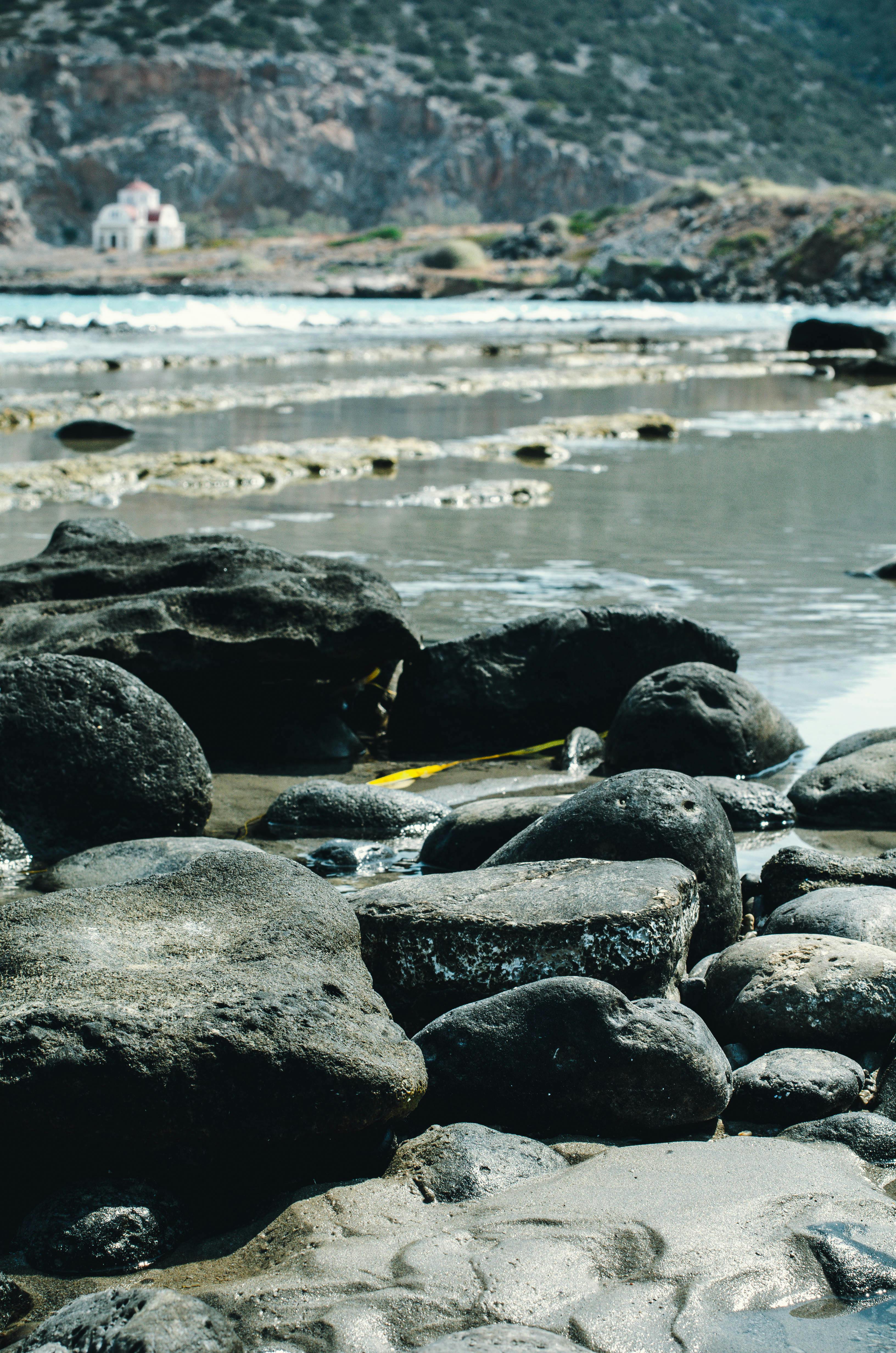 Black Rocks on Seashore · Free Stock Photo