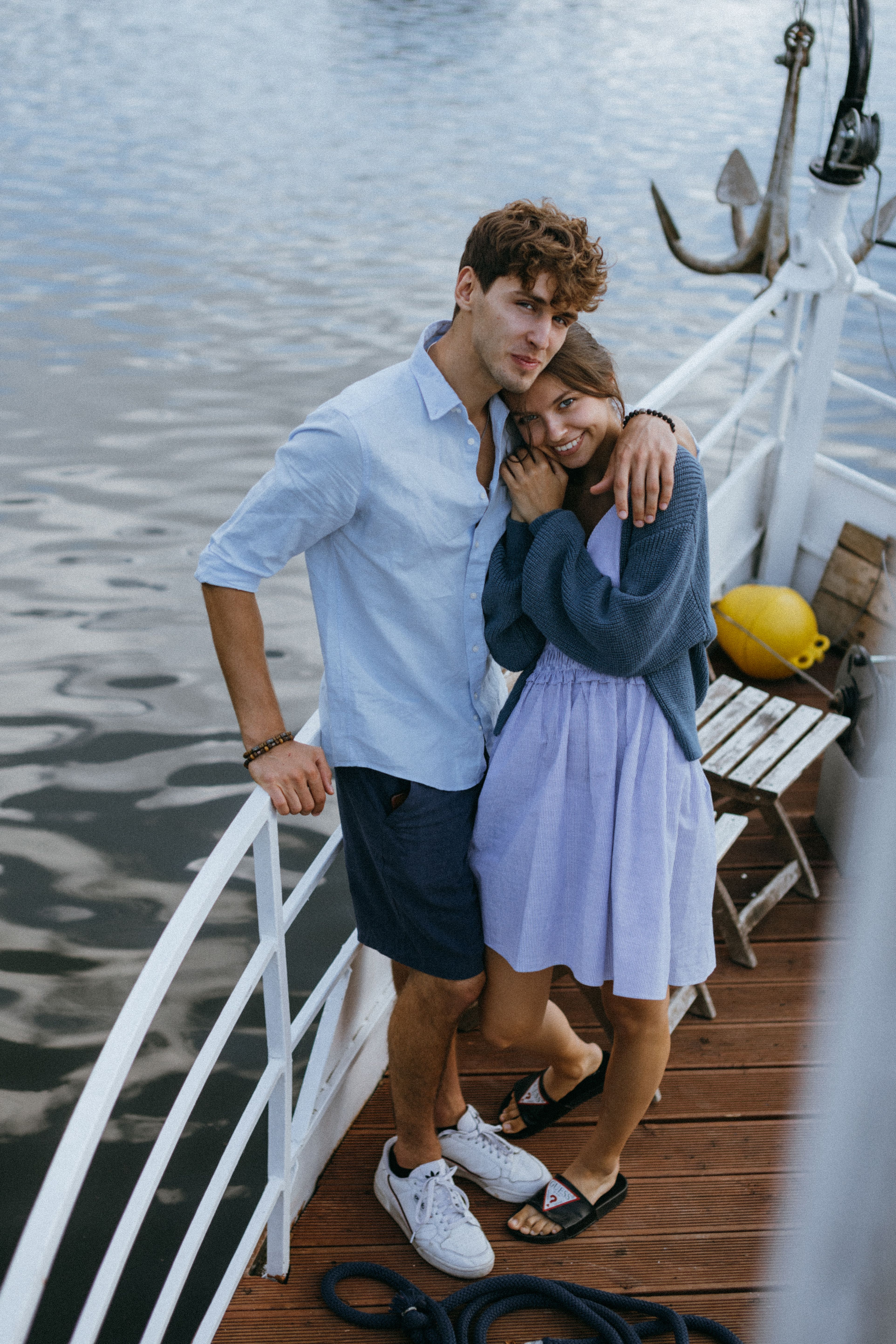 Man Standing Resting his Hand on a Woman's Shoulder · Free Stock Photo
