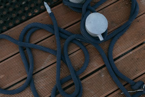 Blue Rope on the Boat Moored on Bollard