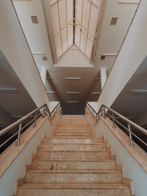 Brown Marble Staircase with Stainless Steel Handrails
