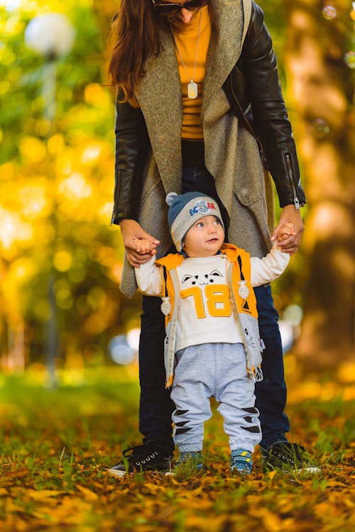 A Woman Holding a Young Boy