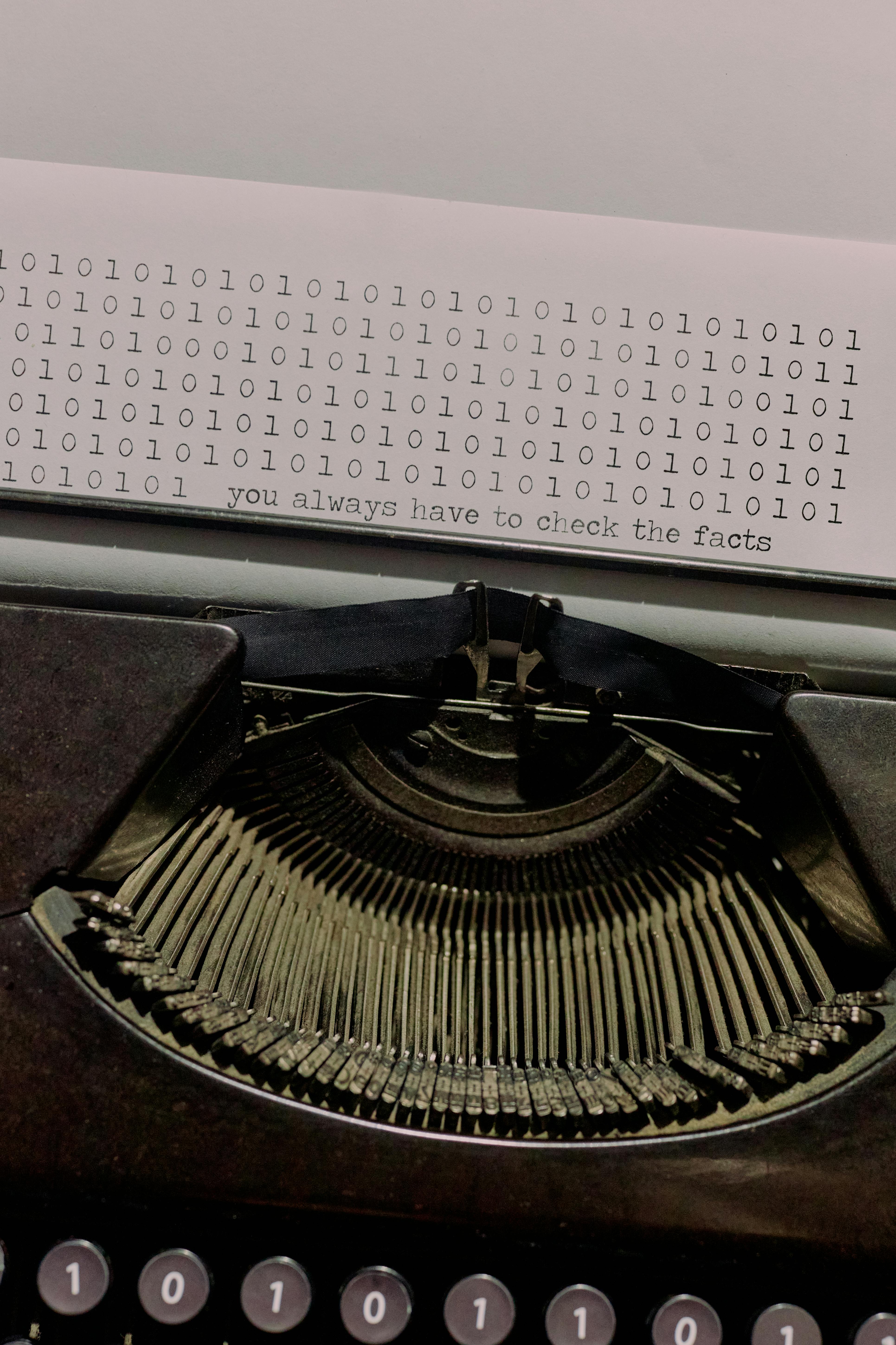 sheet of paper with text sticking from a typewriter