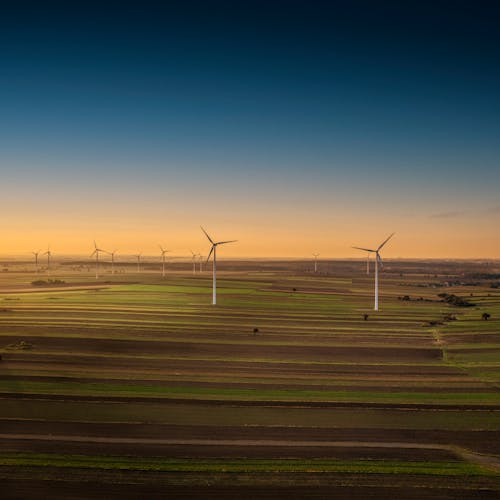 Free Windmill Energy on Green Grass Field Stock Photo