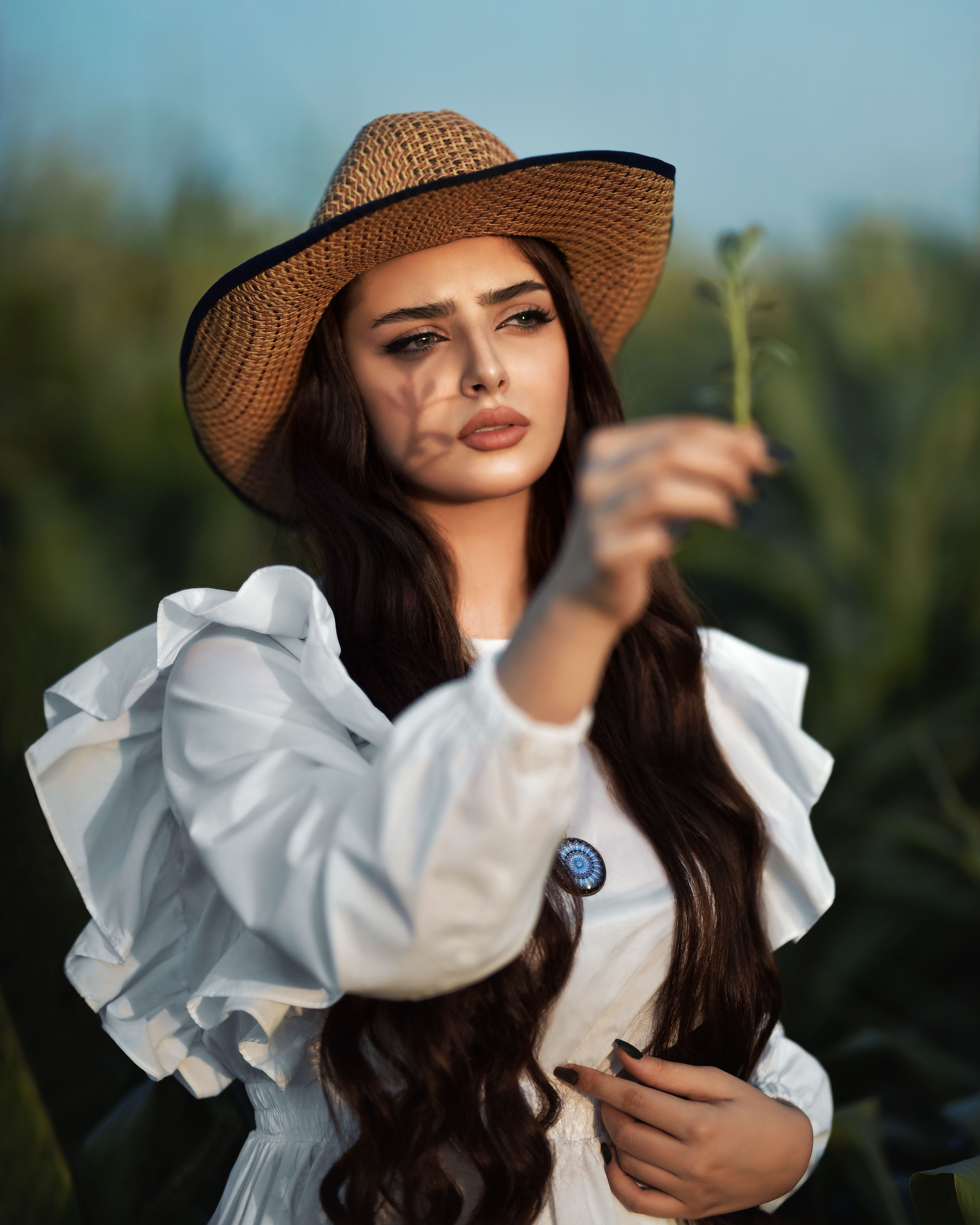Woman in White Long Sleeve Dress Posing · Free Stock Photo
