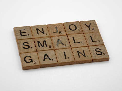 Wooden Scrabble Tiles on White Surface