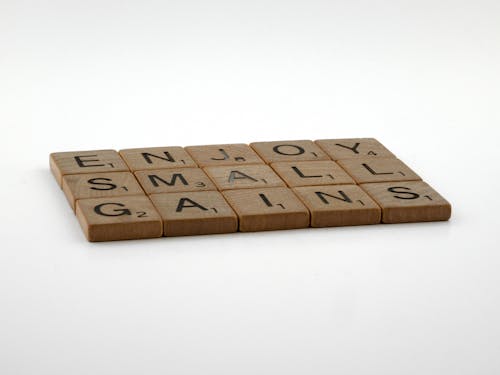 Wooden Scrabble Tiles on White Surface
