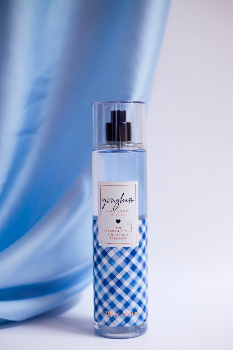 Bath And Body Works Body Mist Near A Light Blue Silk Fabric 