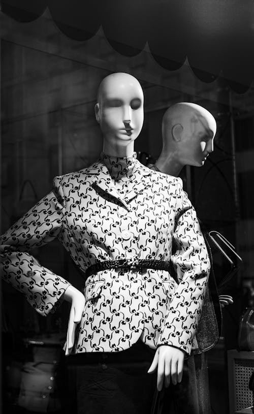 Grayscale Photo of a Mannequins on Display