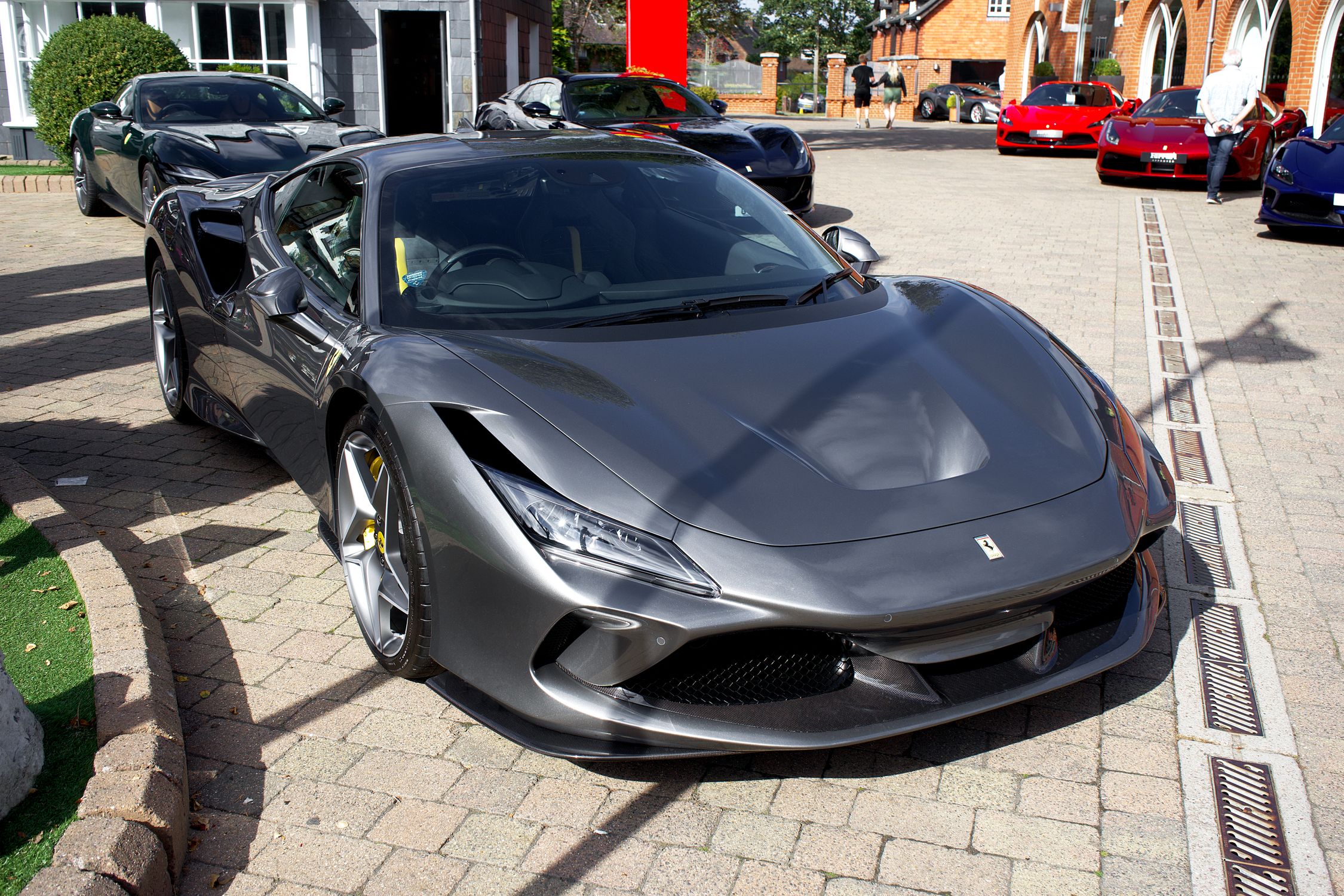 Parked Gray Ferrari F8 on Pavement · Free Stock Photo