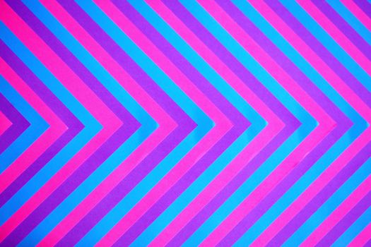 A vivid chevron pattern featuring bold pink and blue colors, ideal for abstract or modern design themes.