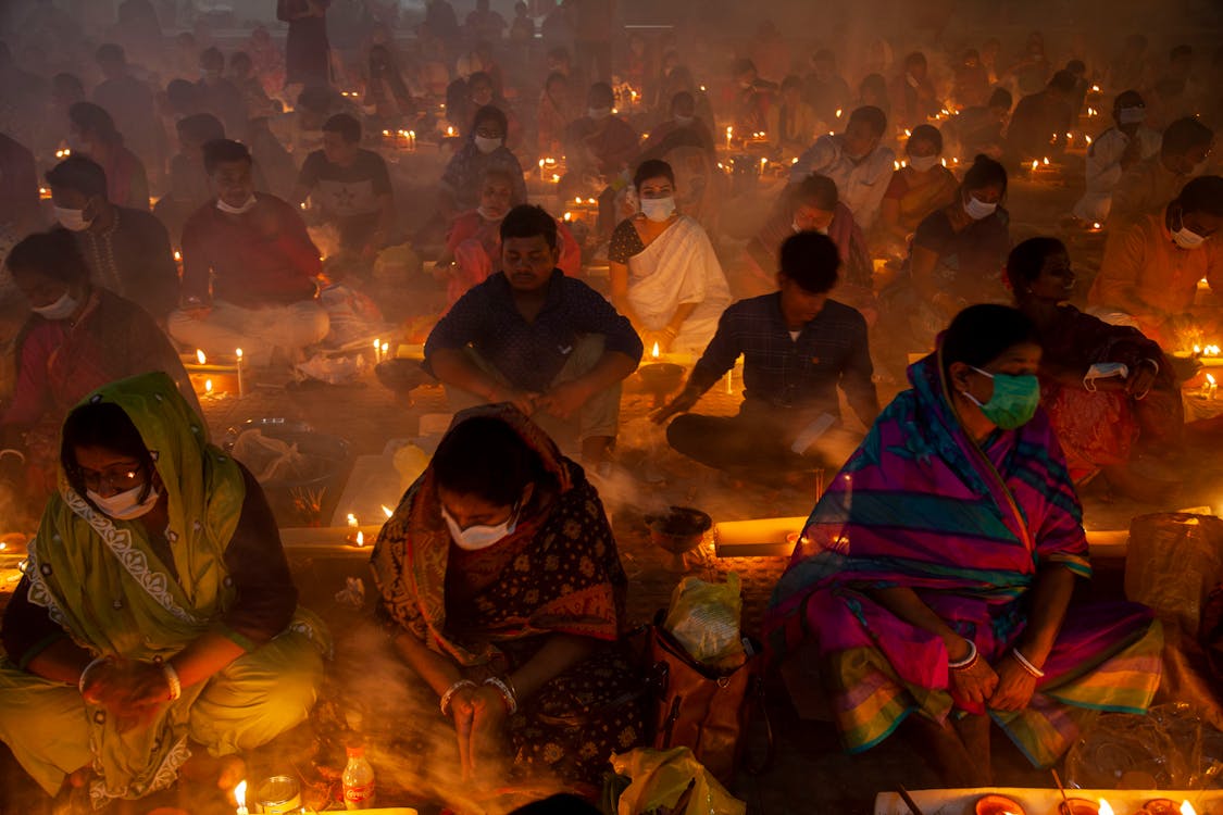 A Group of People Having a Ritual at Night · Free Stock Photo