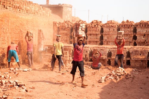 People Building a Brick Wall