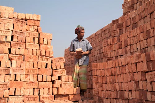 A Man Stacking Bricks