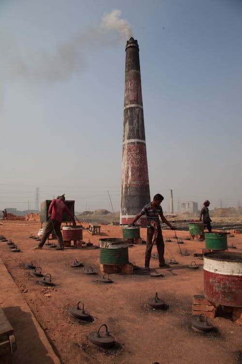 People Working at a Brickfield 