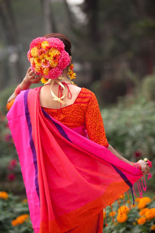 Free A Woman in Pink and Red Saree  Stock Photo