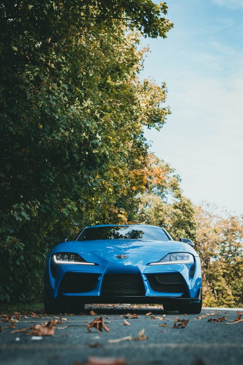 A Blue Sports Car Parked on the Road