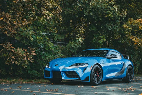 Free A Blue Sports Car Parked on the Road Stock Photo