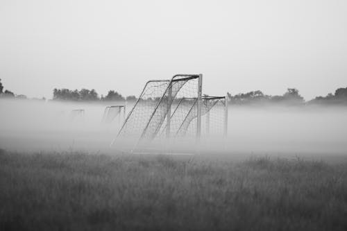 Free Soccer Goal in a Grass Field on a Foggy Day Stock Photo