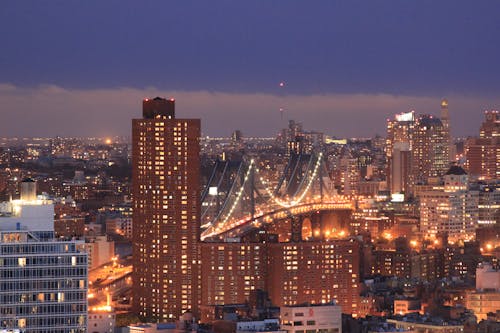 Brooklyn Bridge and New York City Skyline during Night Time