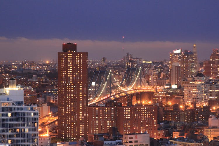 Brooklyn Bridge And New York City Skyline During Night Time