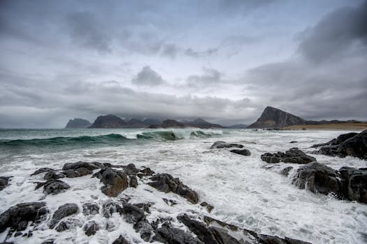 Capture of rocky sea coast with waves in Nordland, Norway's winter landscape.