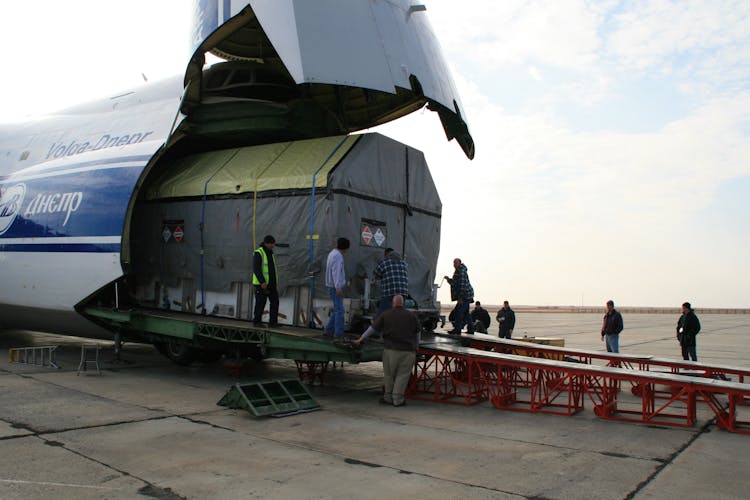 Unloading Cargo From Airplane