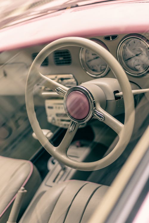 Close-Up Shot of a White Steering Wheel