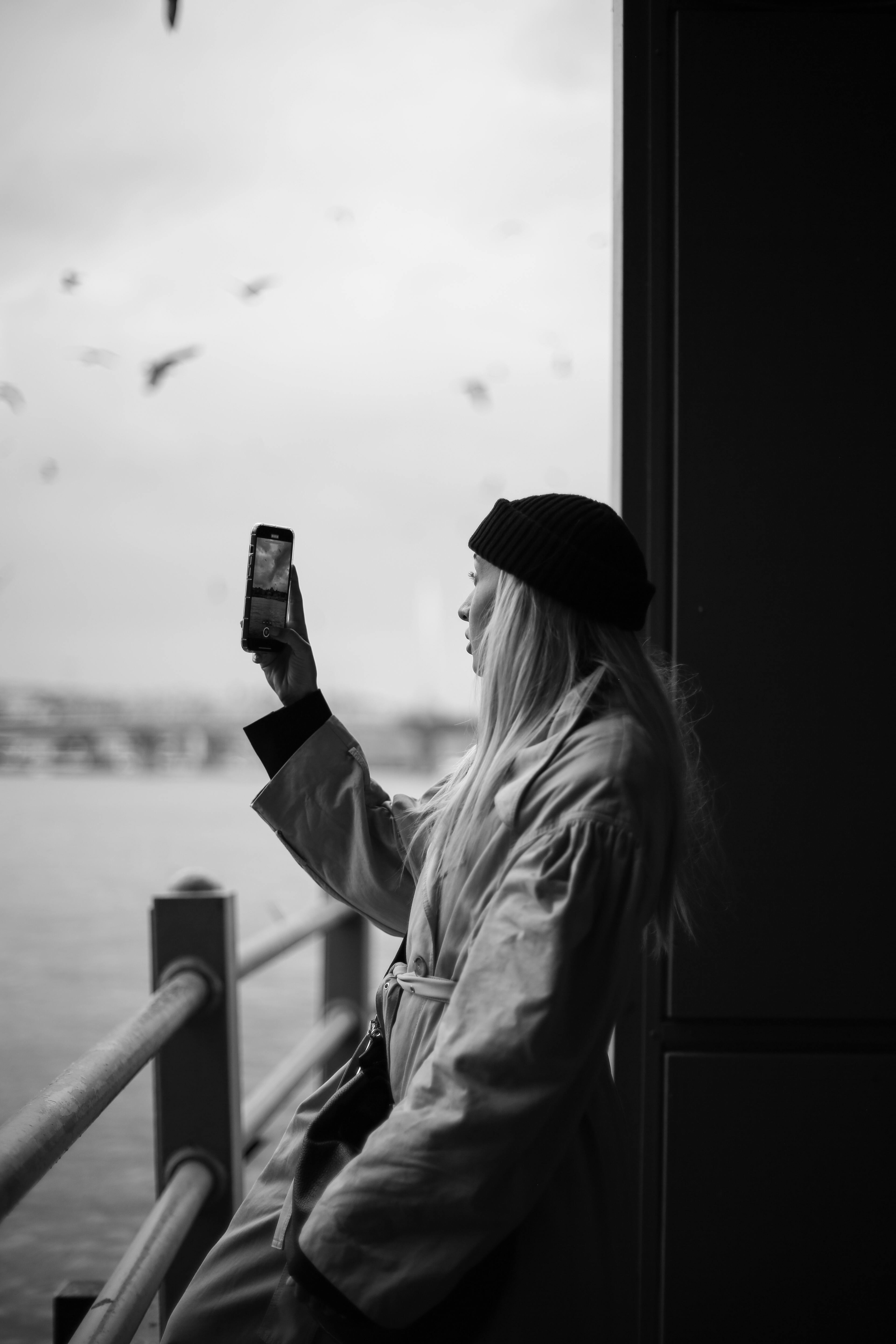 Photographer planning shots with couple and map on a travel shoot