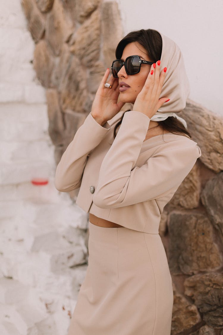 Portrait Of Elegant Woman Wearing Pink Shingle, Scarf And Sunglasses